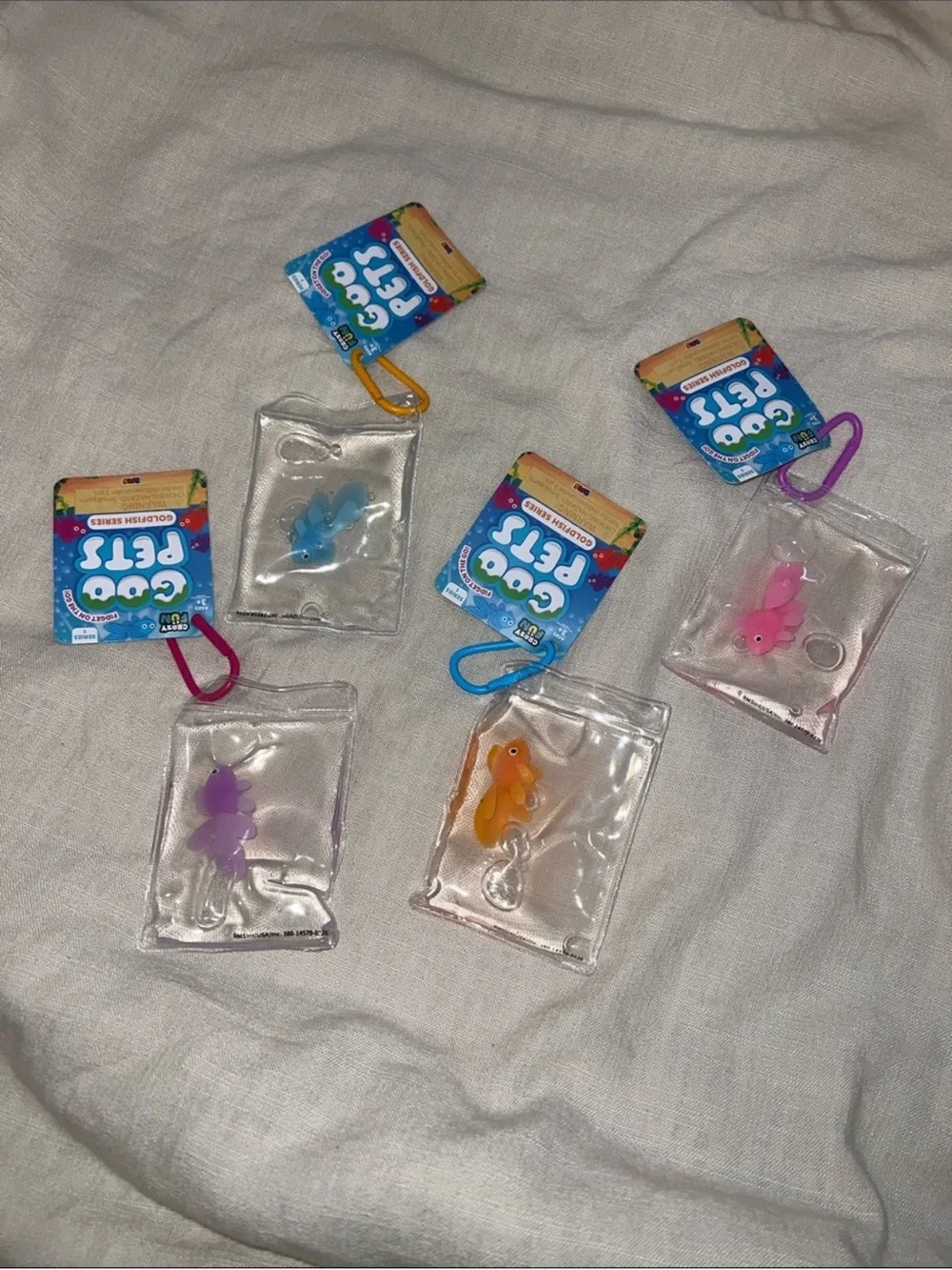 Goo Pets Squishy Goldfish Keychain Pack — Blue, Pink, Orange, Purple